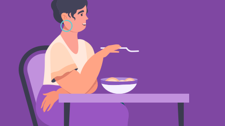 Woman eating a bowl of food