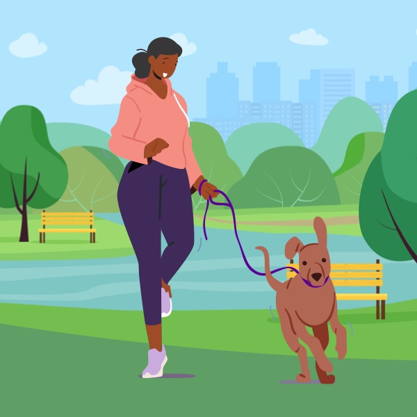 woman walking her dog in a park